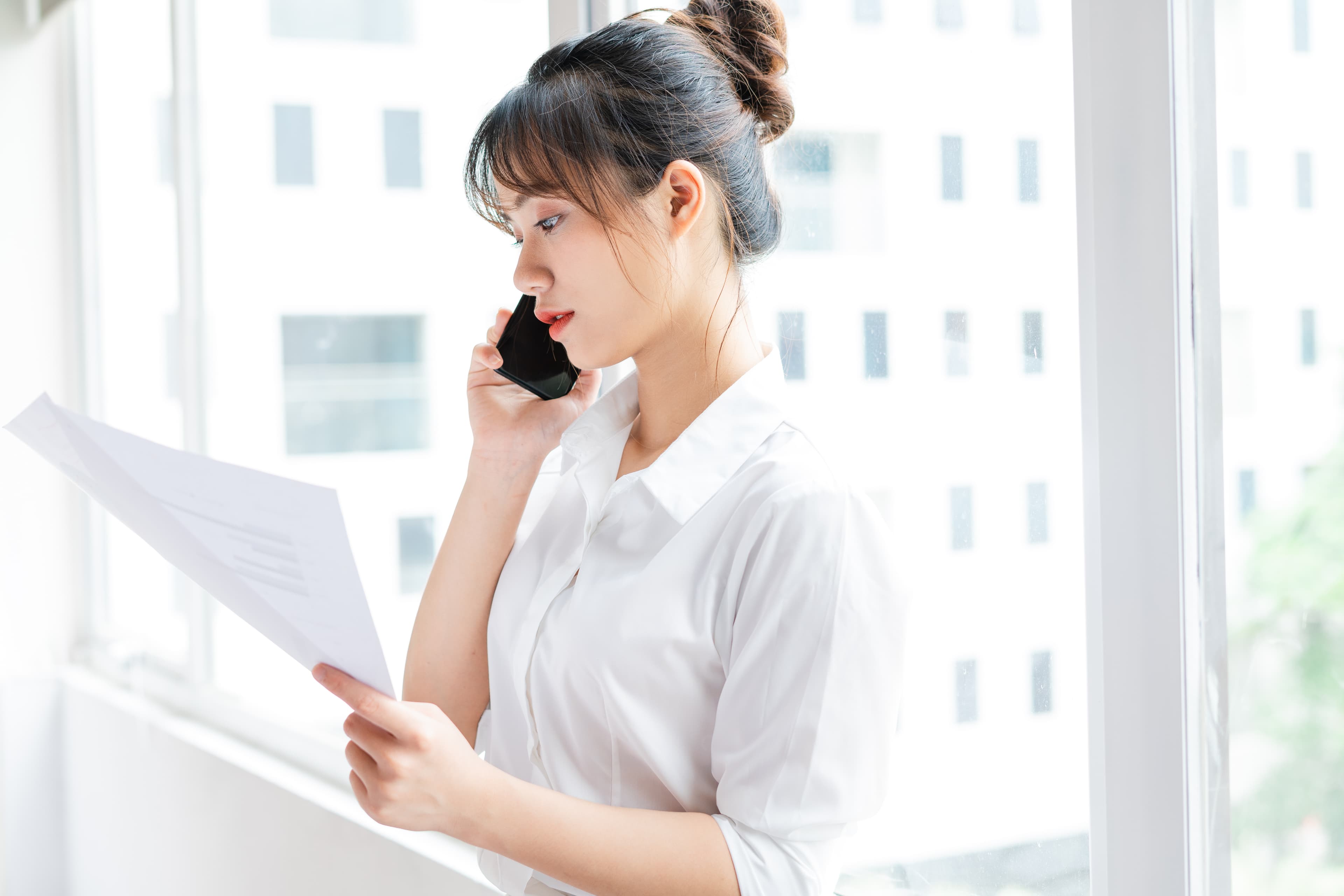 WeCare consultant on a follow-up call reviewing a discharge file