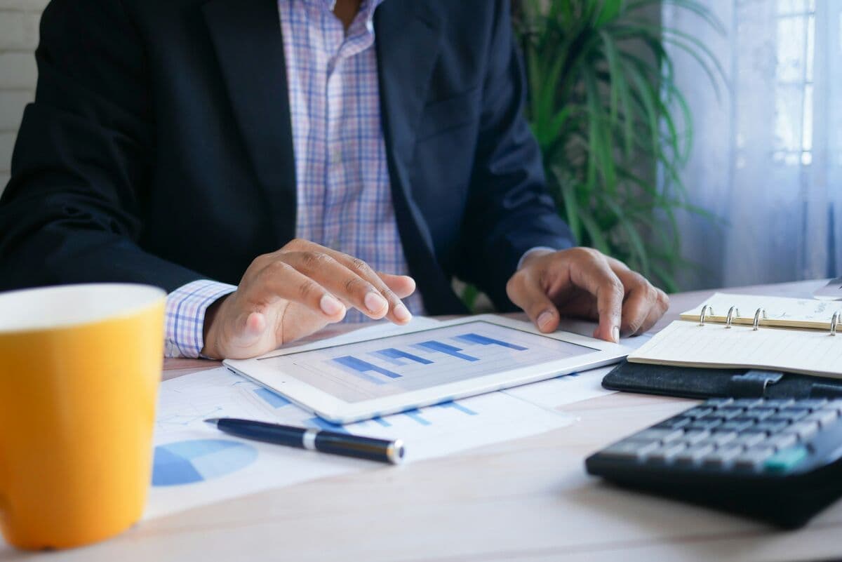 Advisor reviewing a debt repayment plan on a tablet